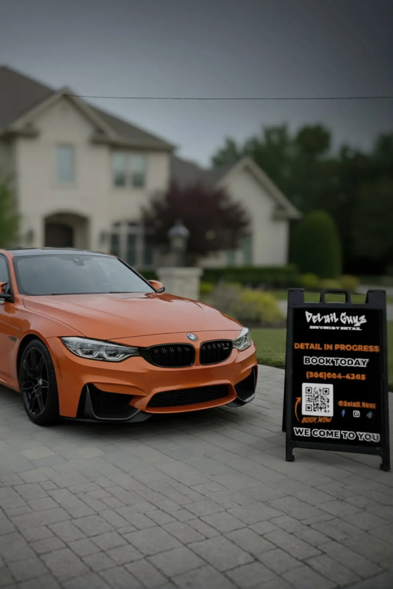 Orange BMW M4 detailed on site