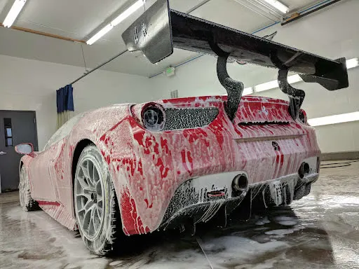 Foam bath on a supercar during a full exterior detail