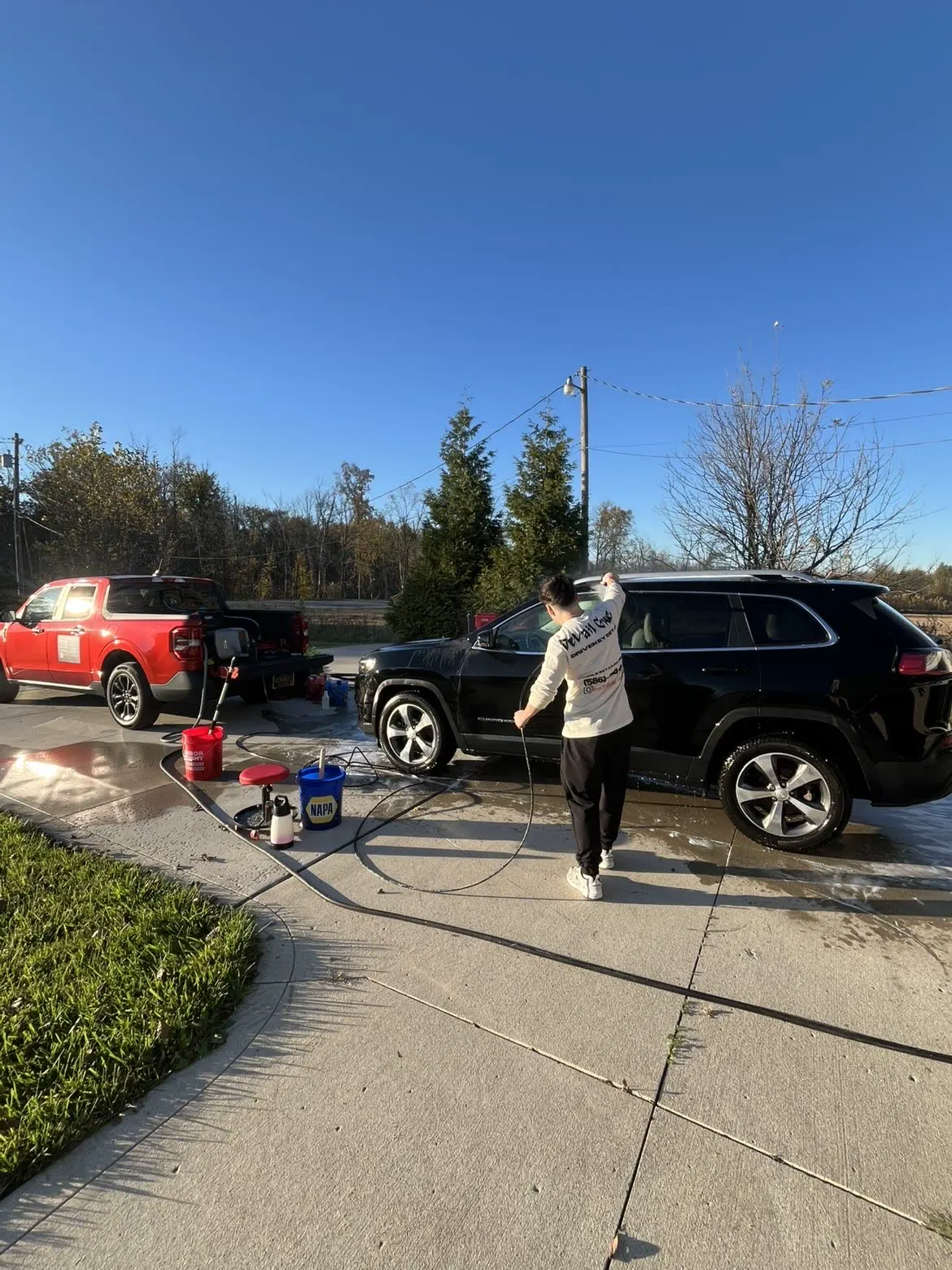 Two-vehicle detail at a Macomb home