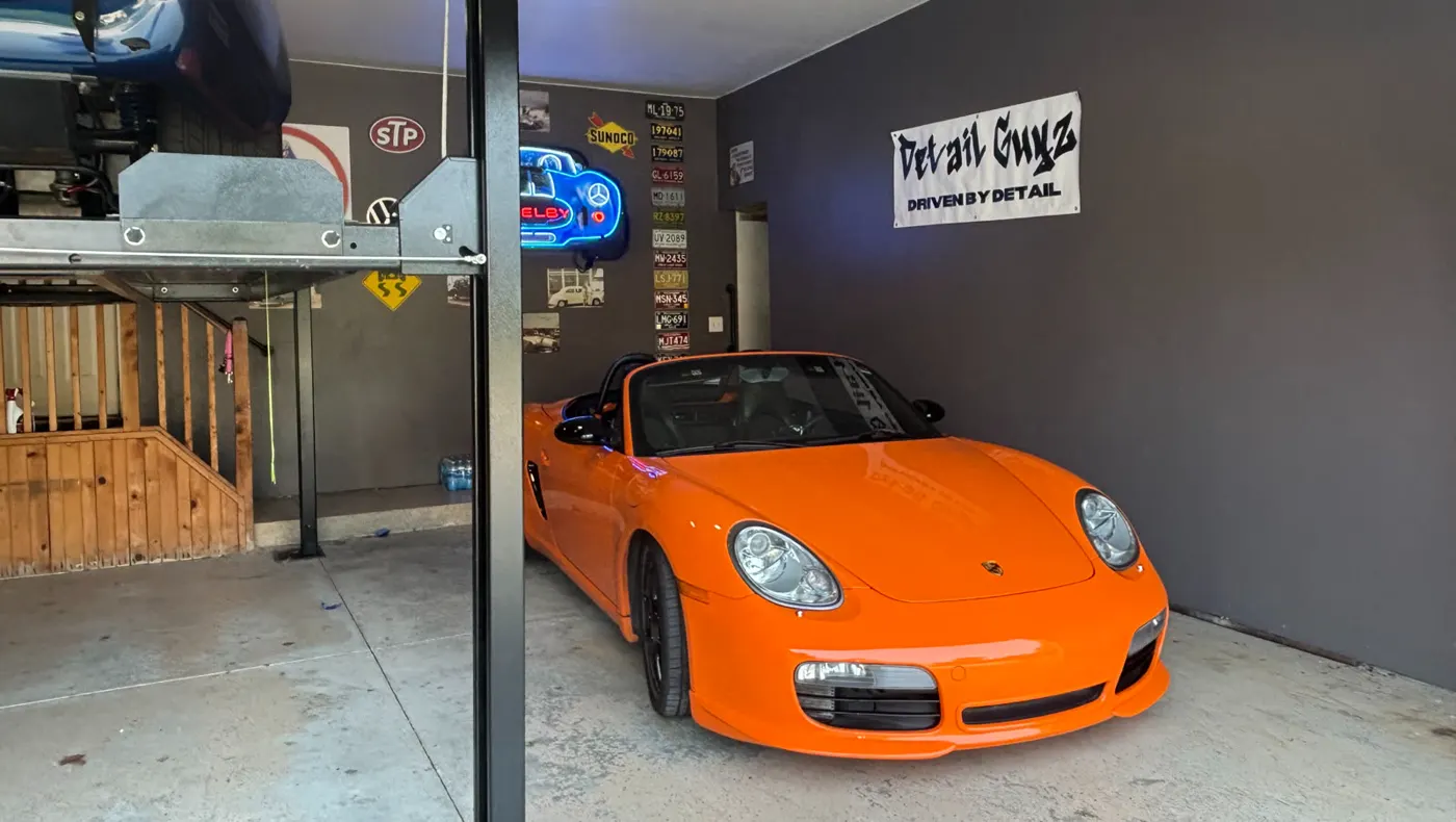 Orange Porsche finished inside the Detail Guyz shop
