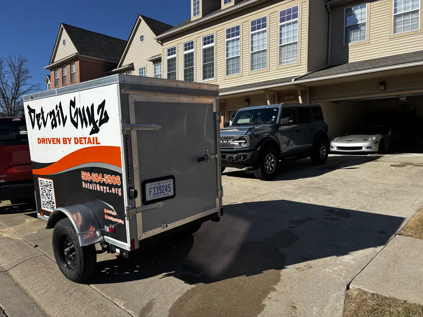 The Detail Guyz mobile trailer at a job