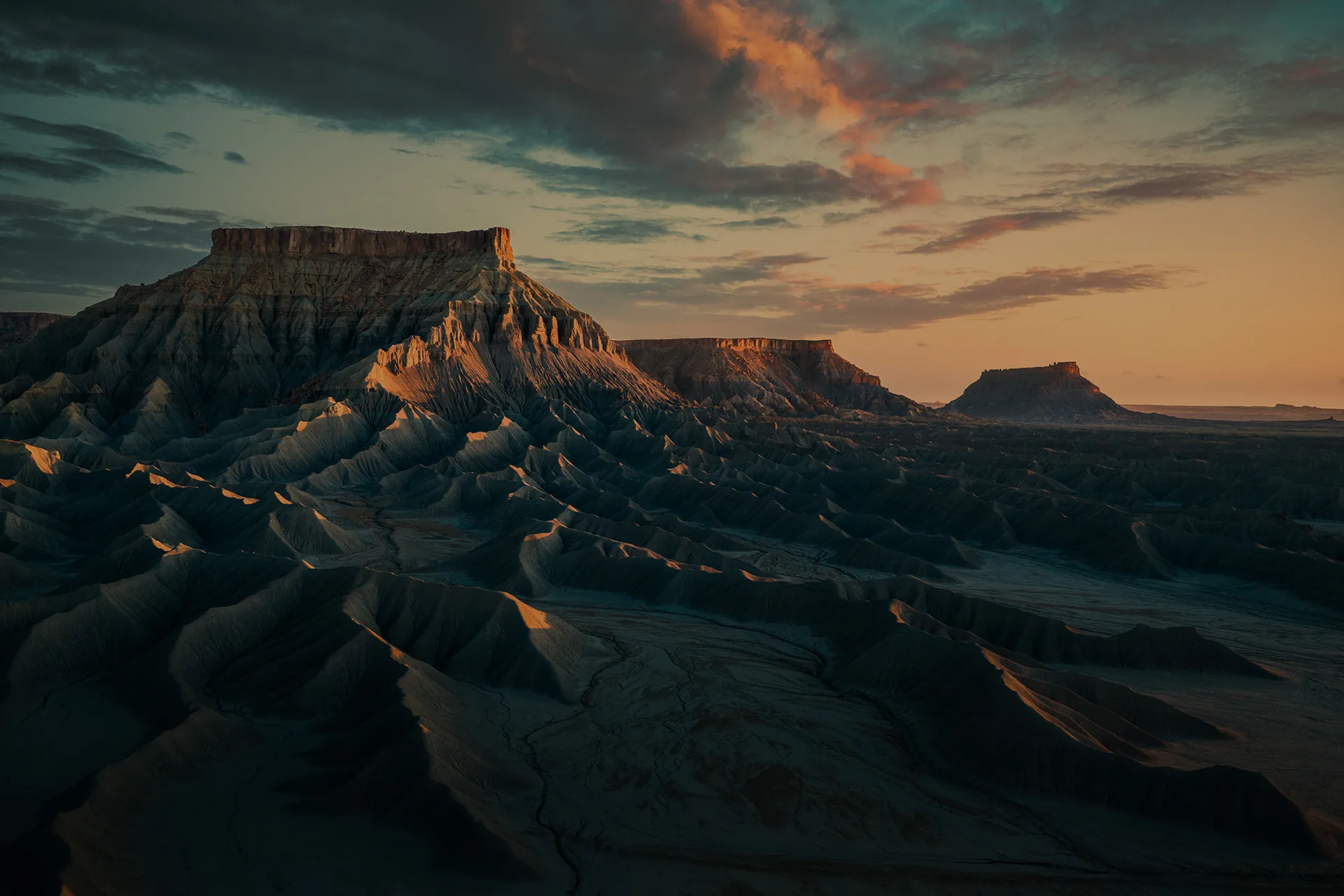 Dramatic desert buttes glowing at sunset in Utah's canyon country
