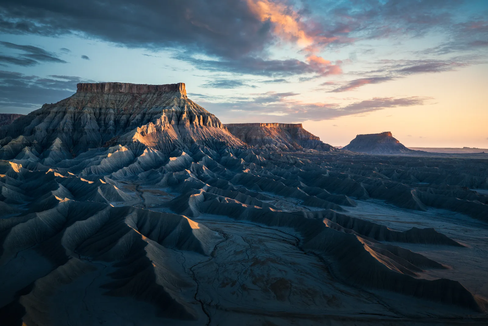 Dramatic desert buttes glowing at sunset in Utah's canyon country
