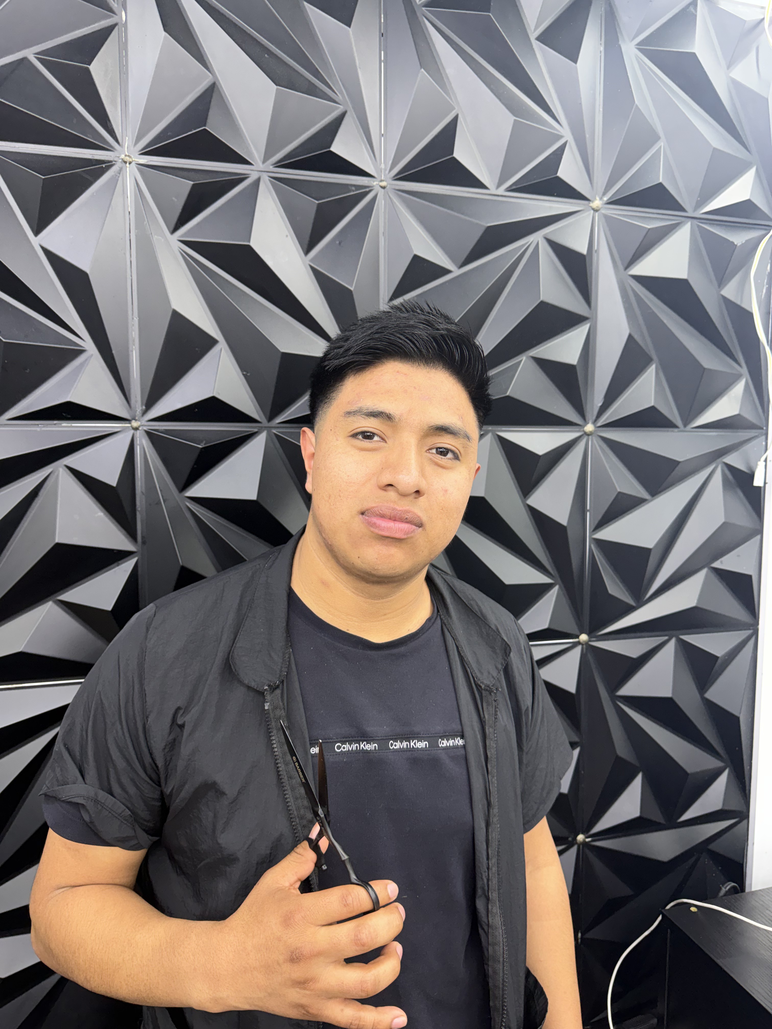 Joel Toc, barber at ML Barber Shop