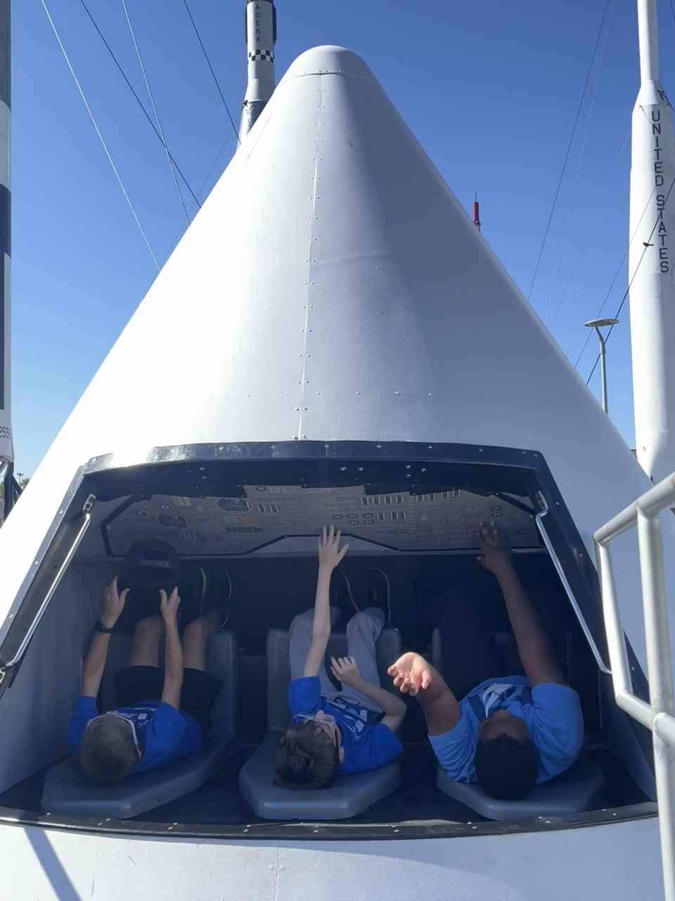 Middle School learners inside a spacecraft simulator