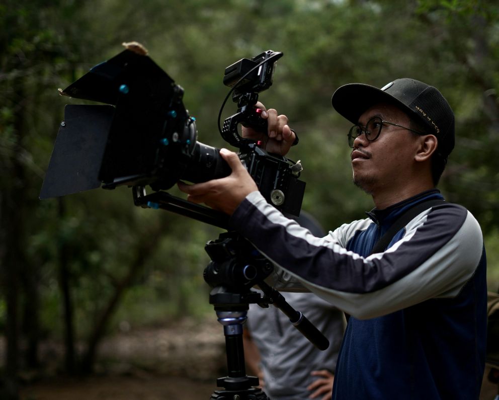 man holding video camera man holding video camera