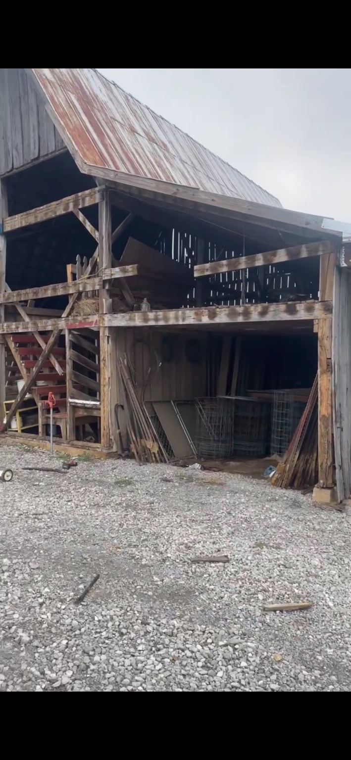 JT's Flag Barn — Replacement wood siding installed on the barn facade