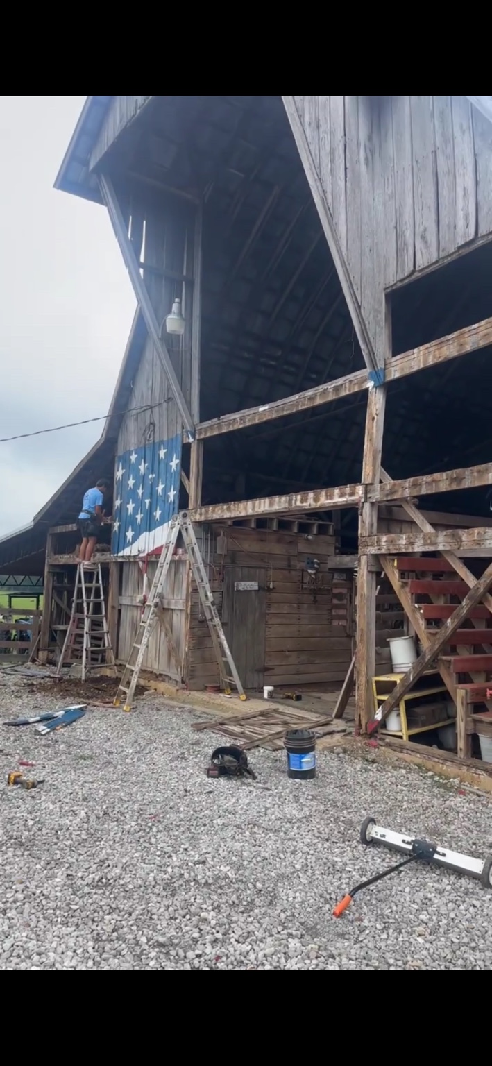 JT's Flag Barn — Side elevation of the barn during the siding renovation
