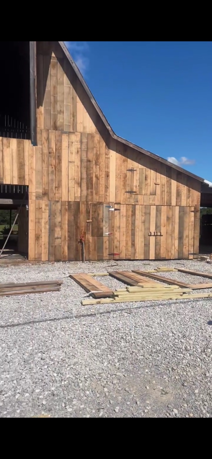 JT's Flag Barn — New wood siding fitted carefully around the American flag artwork