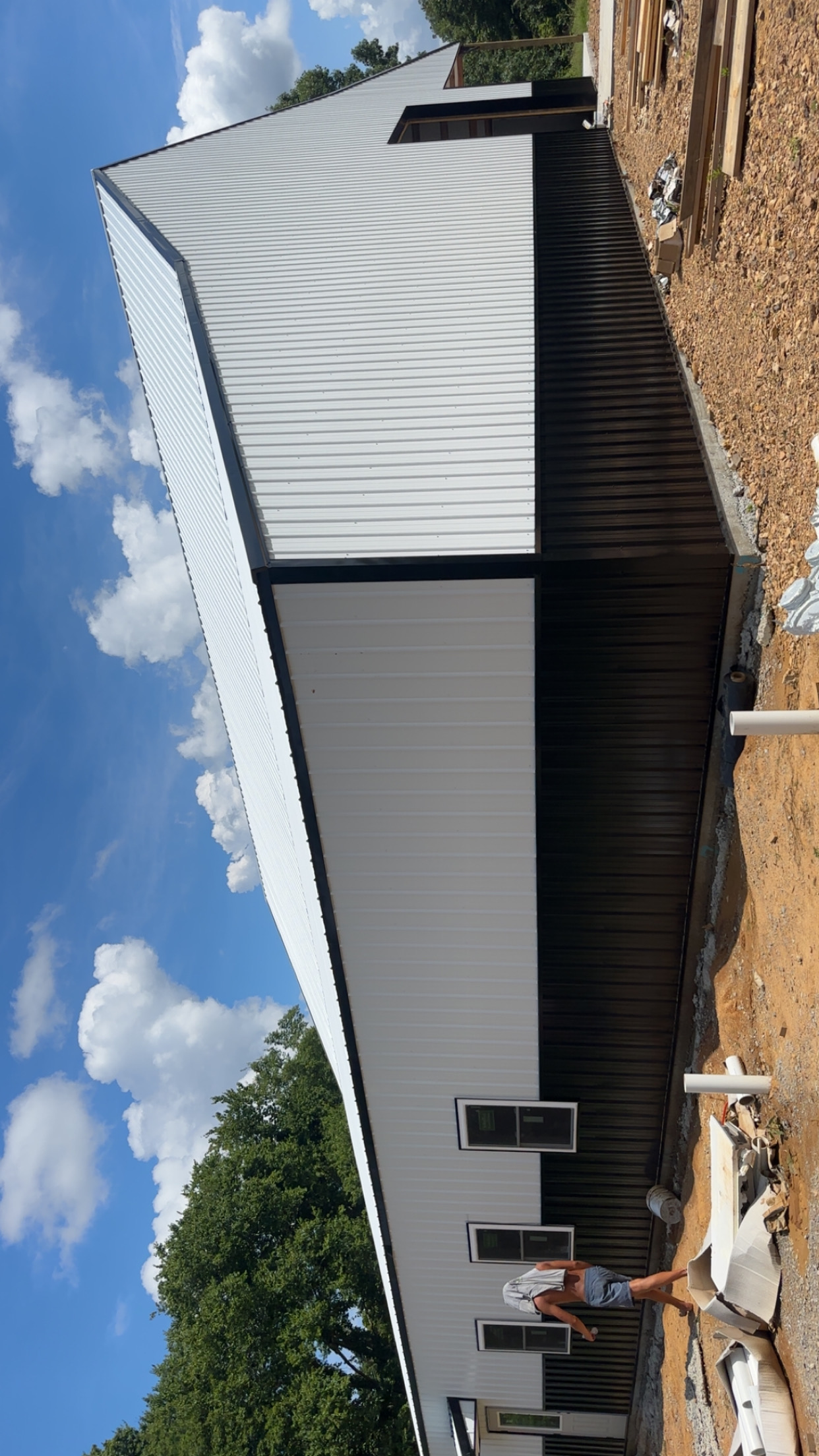 Duck River Honey Co. — Roofline and metal panel installation on the commercial building