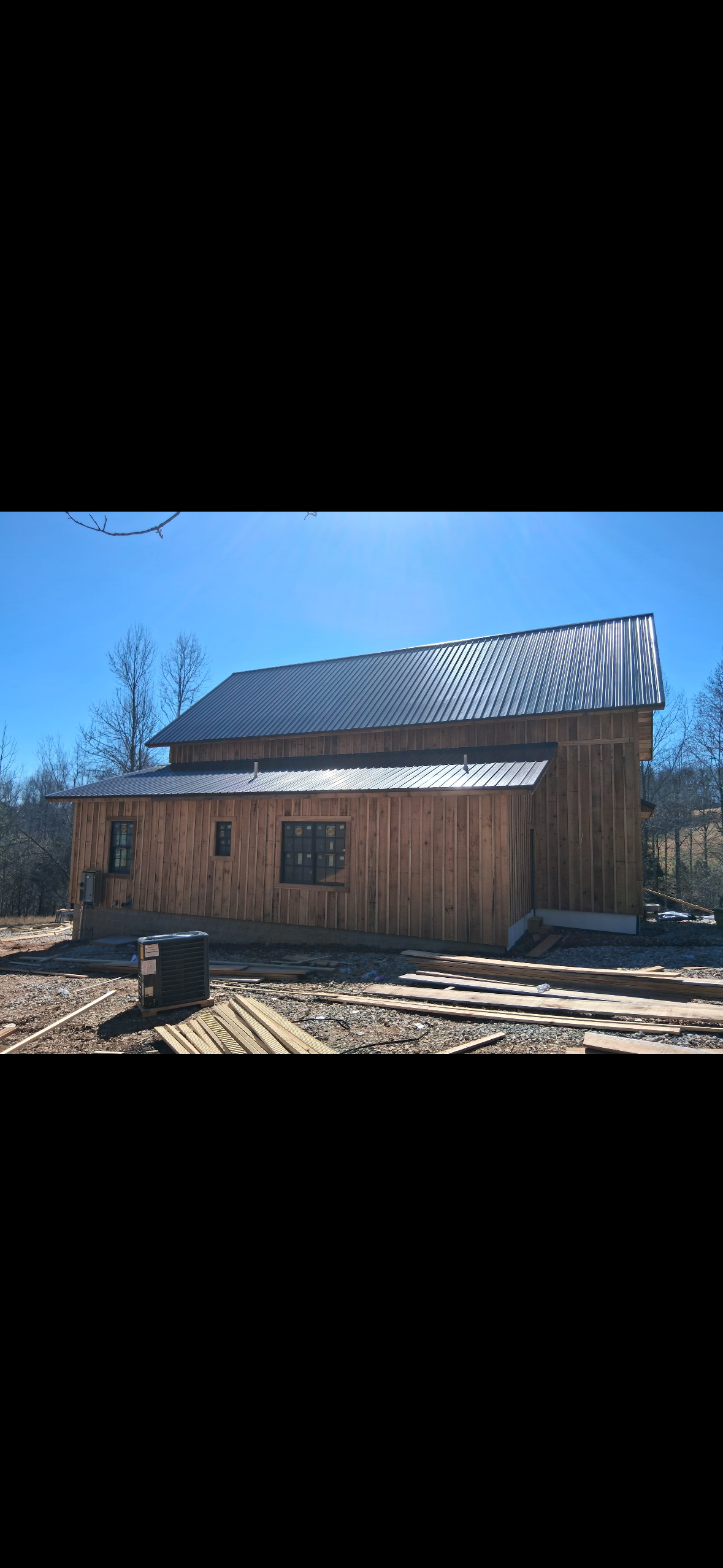 Rustic Custom Home — Porch and wall construction detail on the custom home