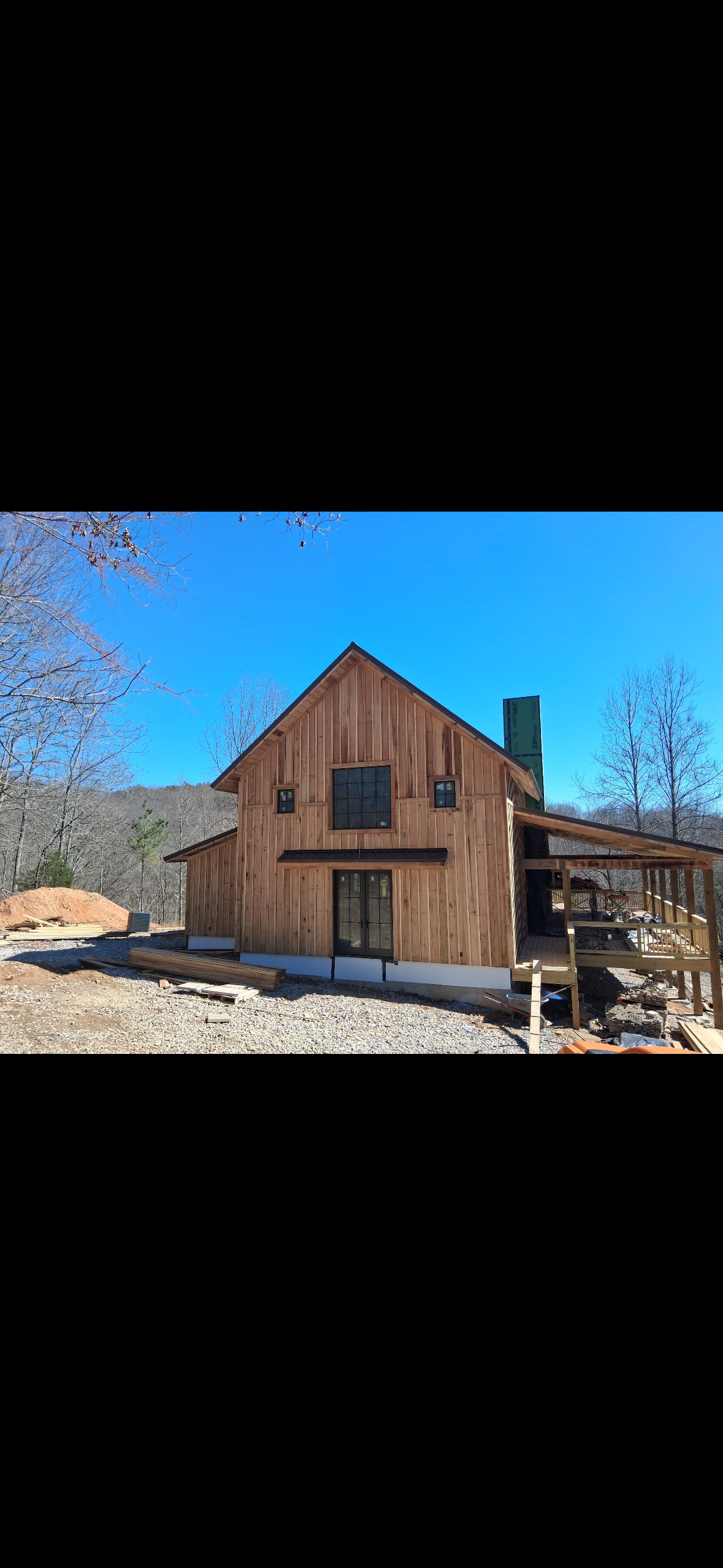 Rustic Custom Home — Exterior elevation detail of the stick-built country home