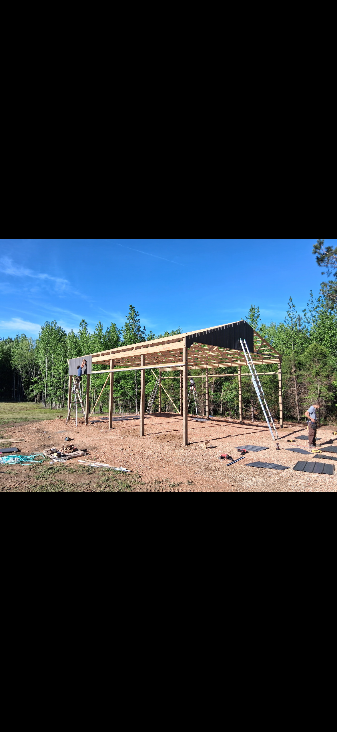 Open-Sided Pole Barn — Post-and-truss construction detail during the pole barn build