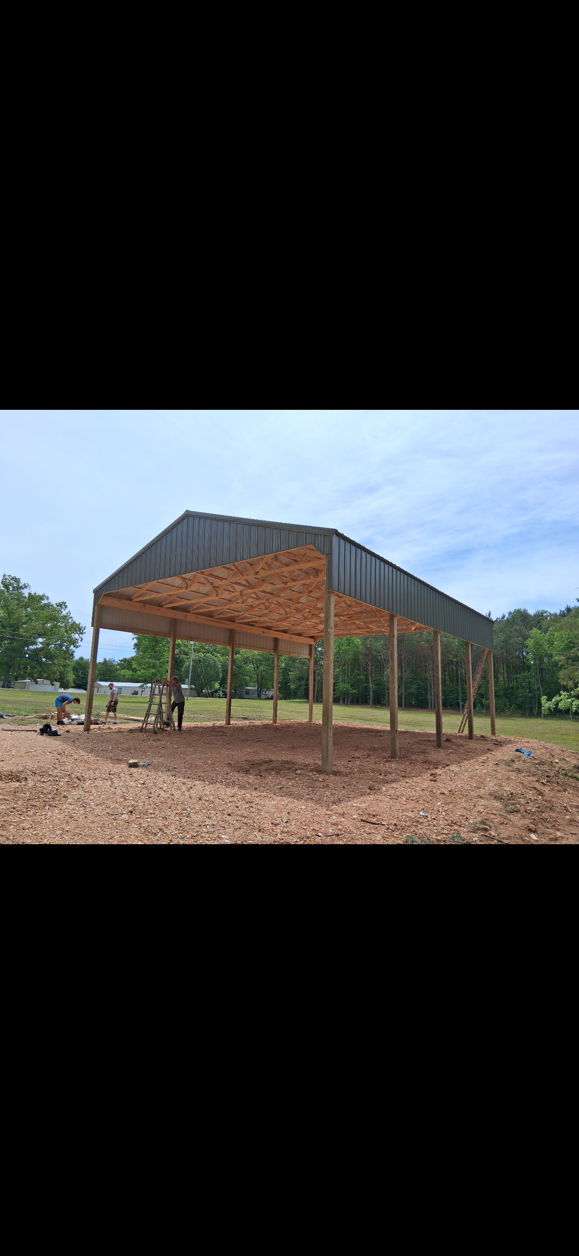 Open-Sided Pole Barn — Roof framing and truss installation on the open-sided pole barn