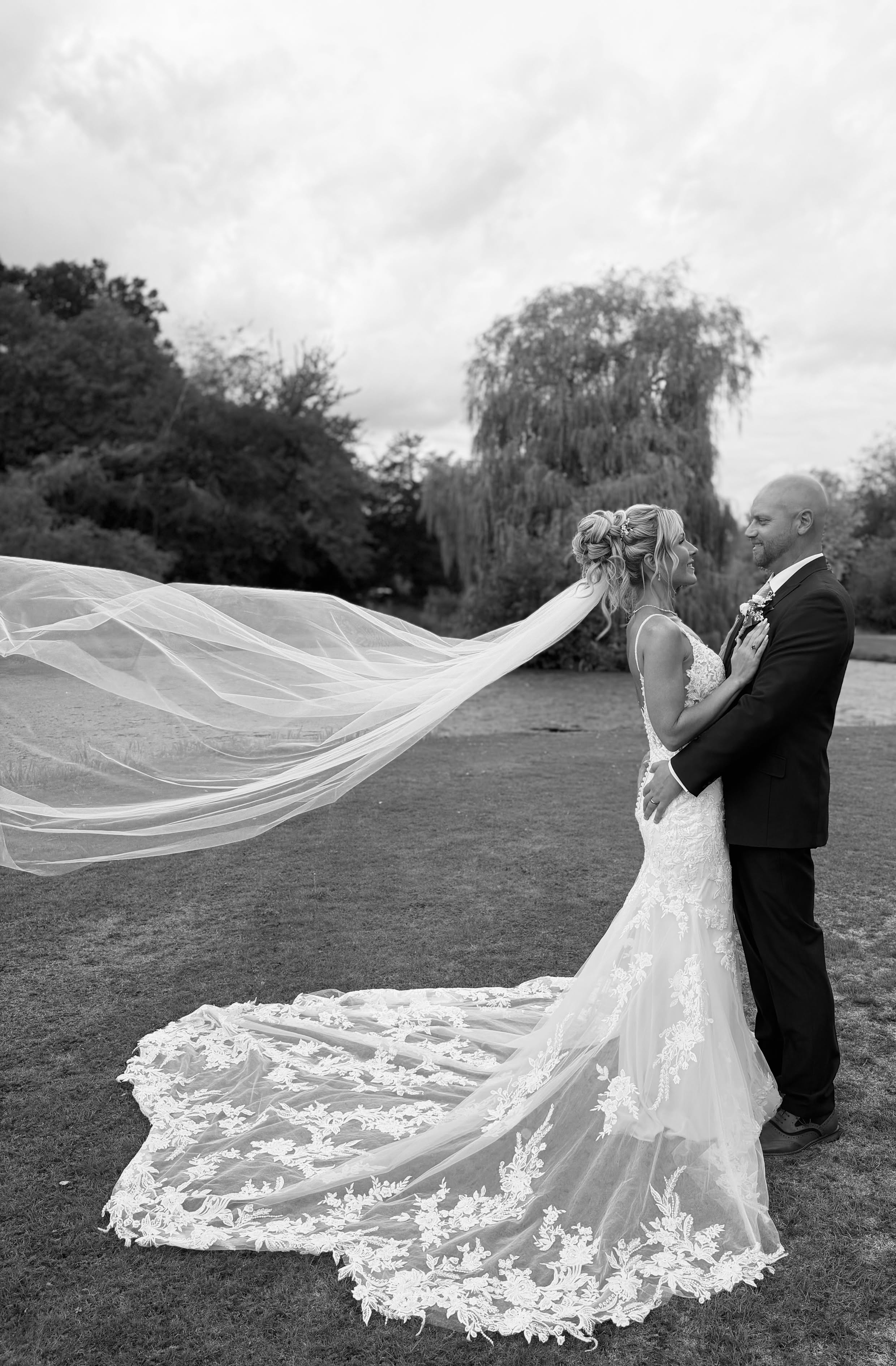 Bride and groom smiling at each other