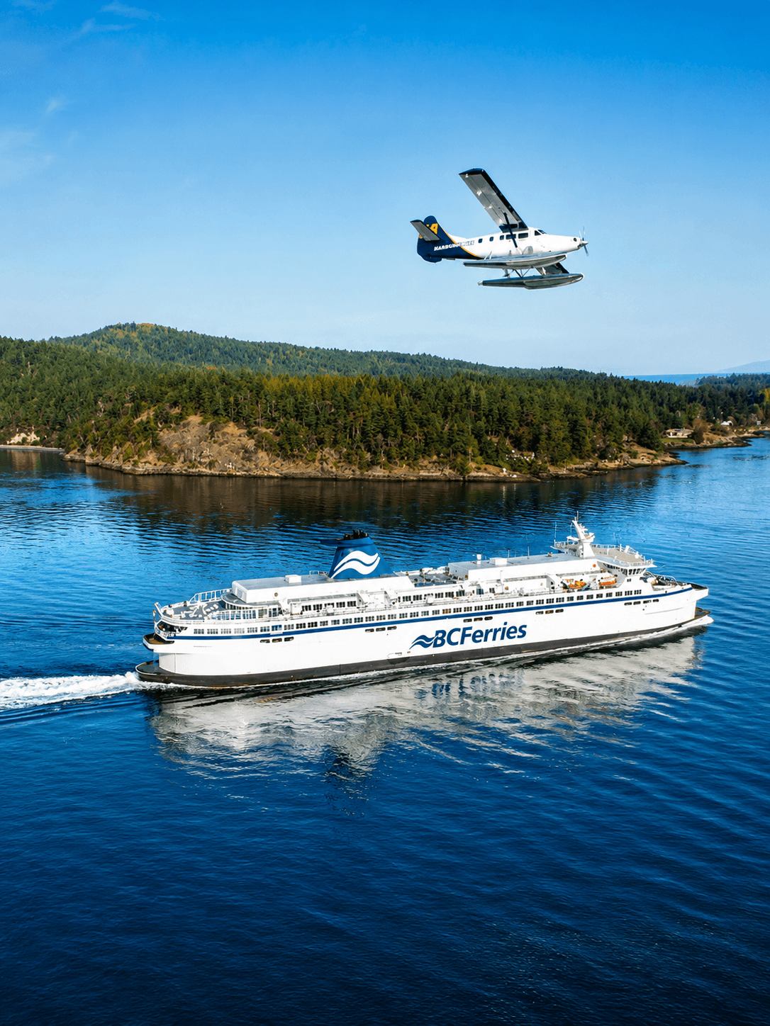 Hullo Ferries crossing with seaplane overhead