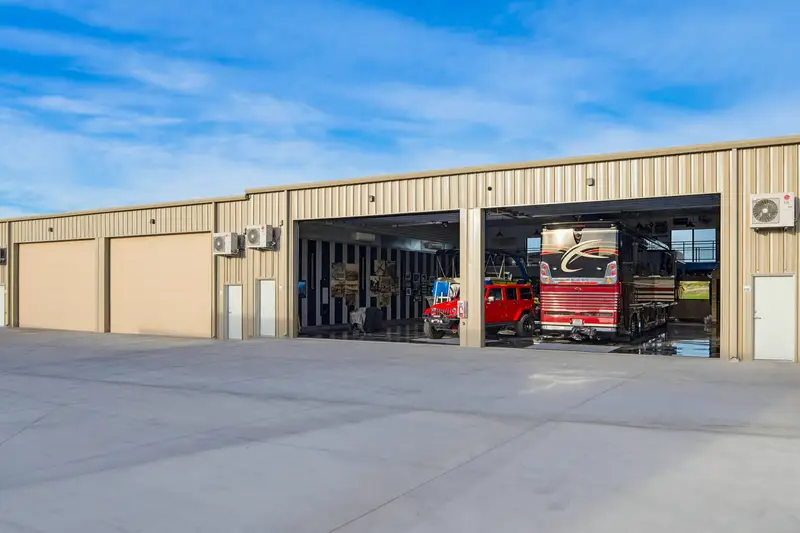 Row of garage doors with an open double RV bay