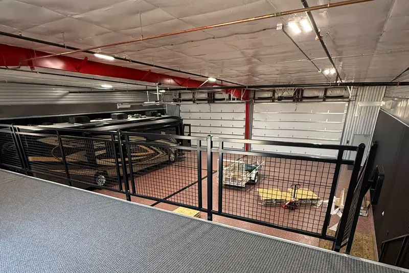 View from a mezzanine loft over a garage bay