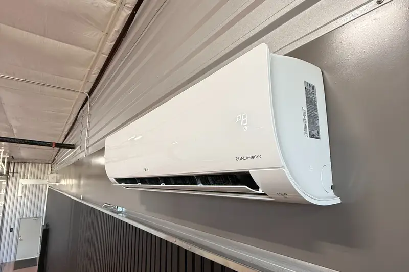 Mini split air conditioner mounted in a garage