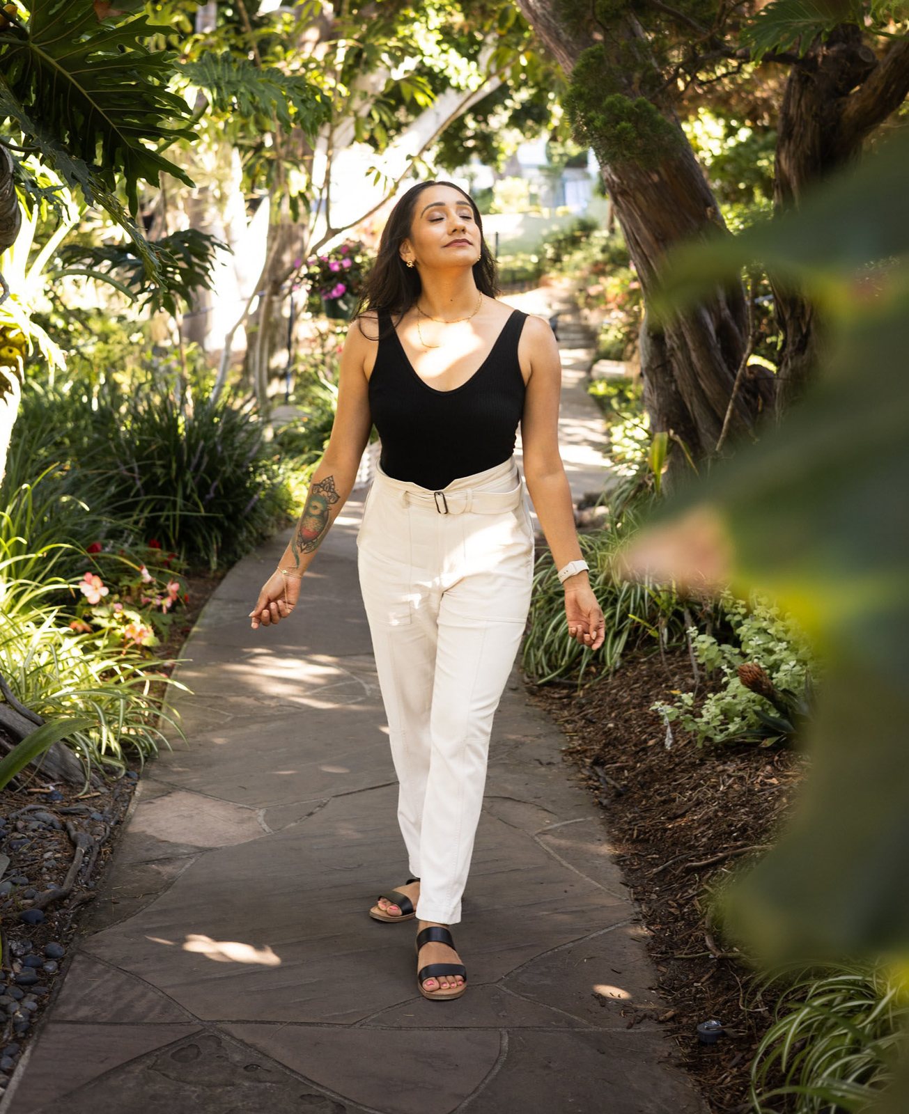 Andrea Arroyo in a garden, at ease