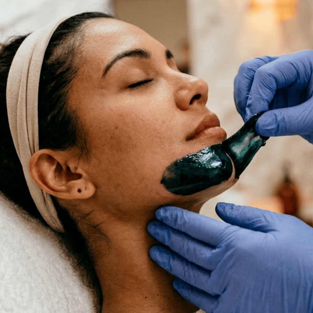 chin waxing patient experiencing waxing strip removal at the Waxing Queen of Tucson