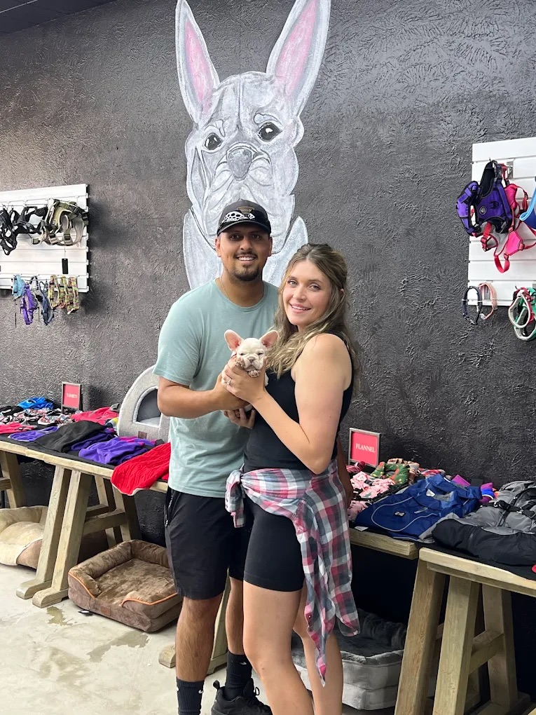 Couple with frenchie puppy