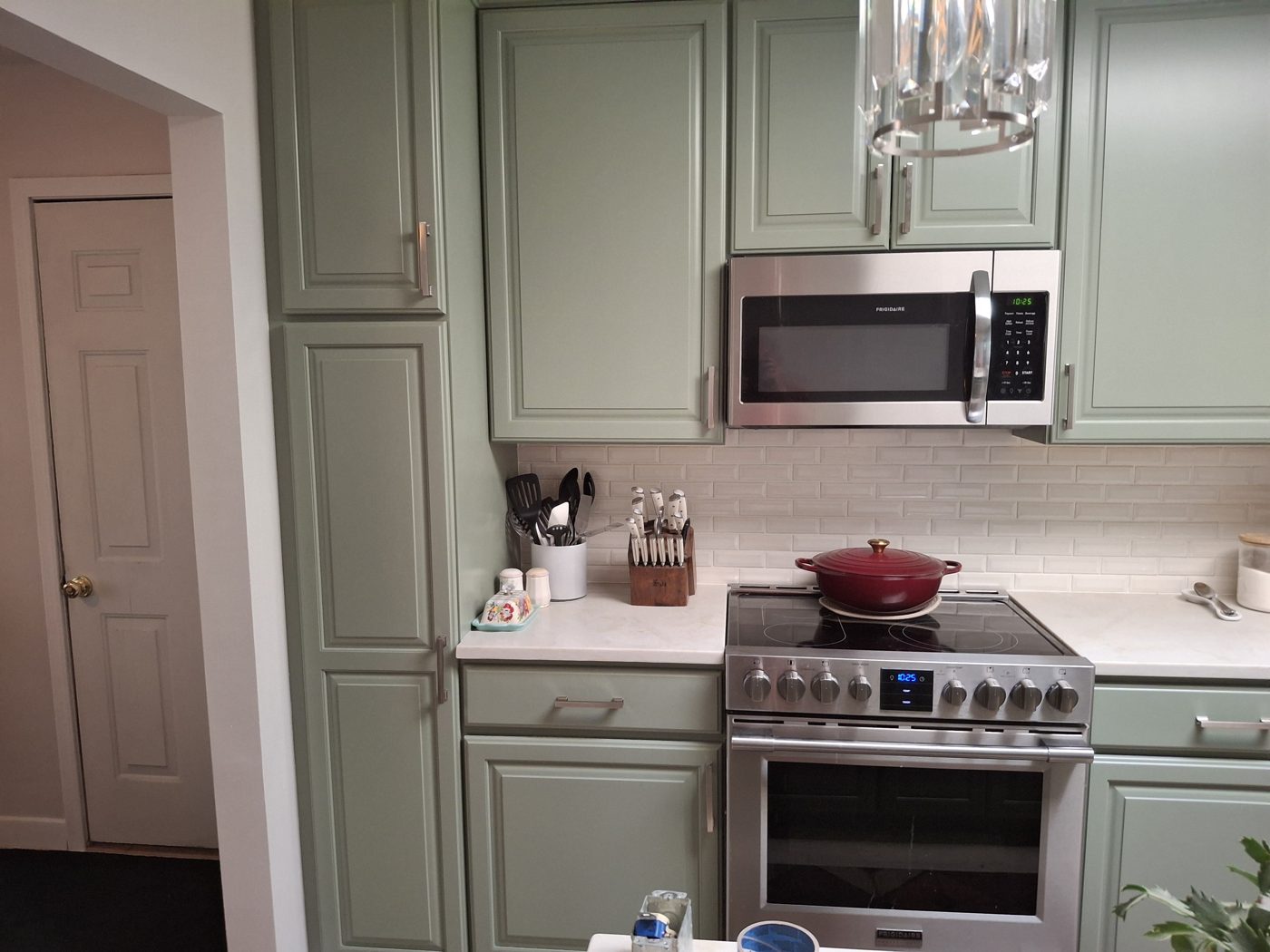 Remodeled kitchen with new cabinets and range in a Denver-area home