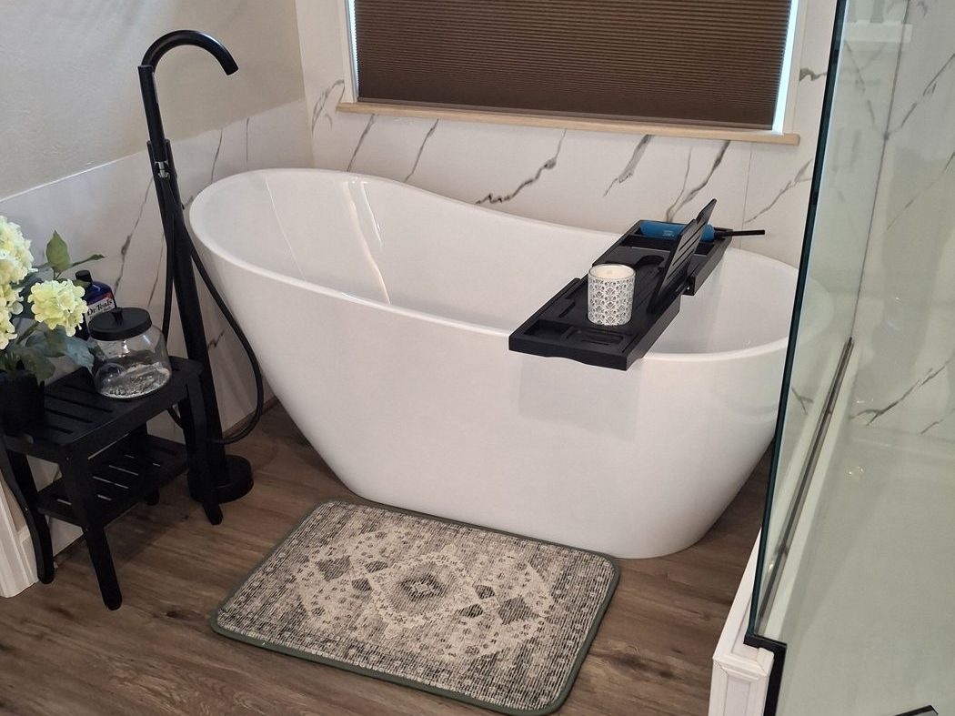 Remodeled bathroom with a freestanding soaking tub in a Denver-area home