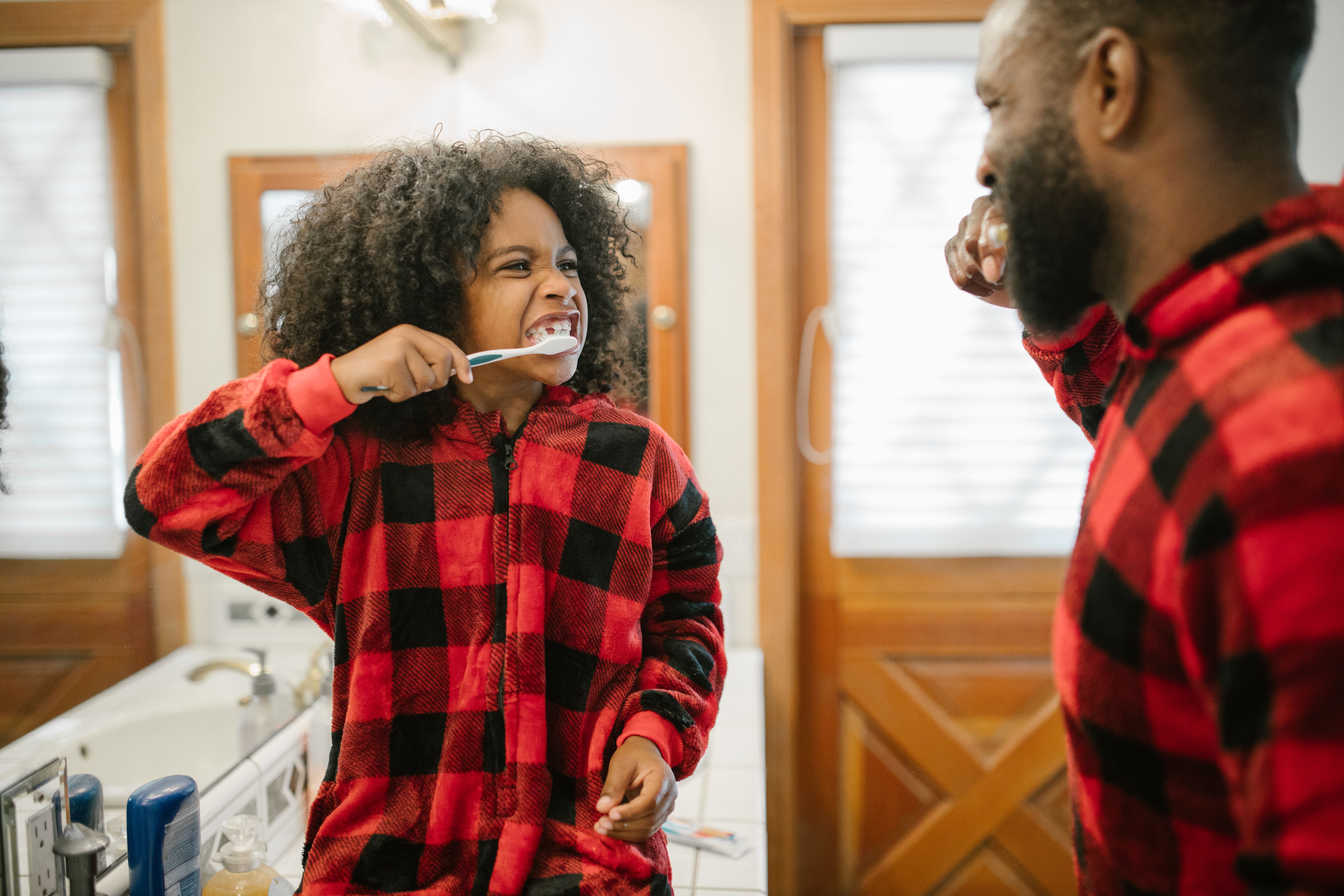 Child brushing teeth
