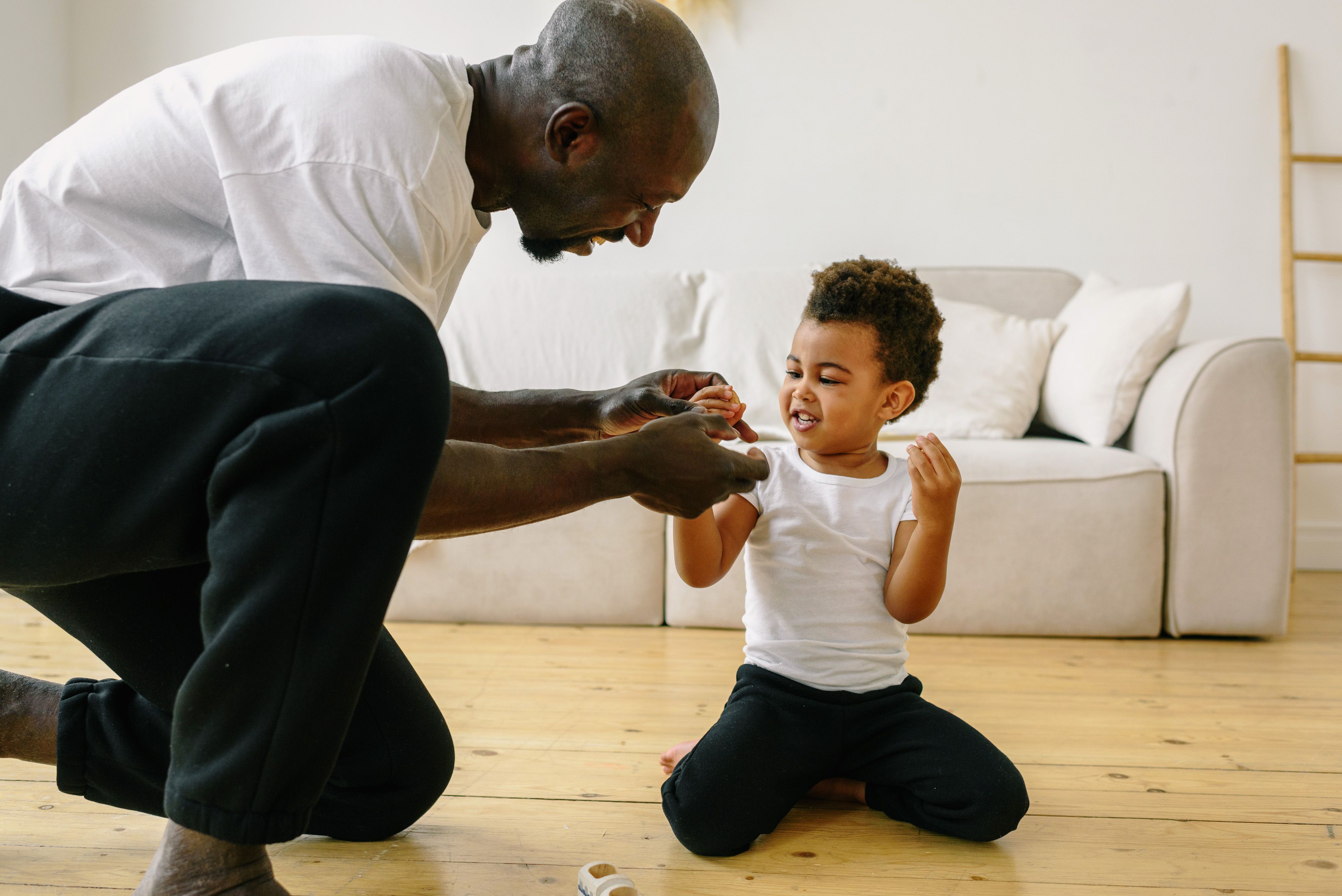 Adult kneeling at child's level during naturalistic play