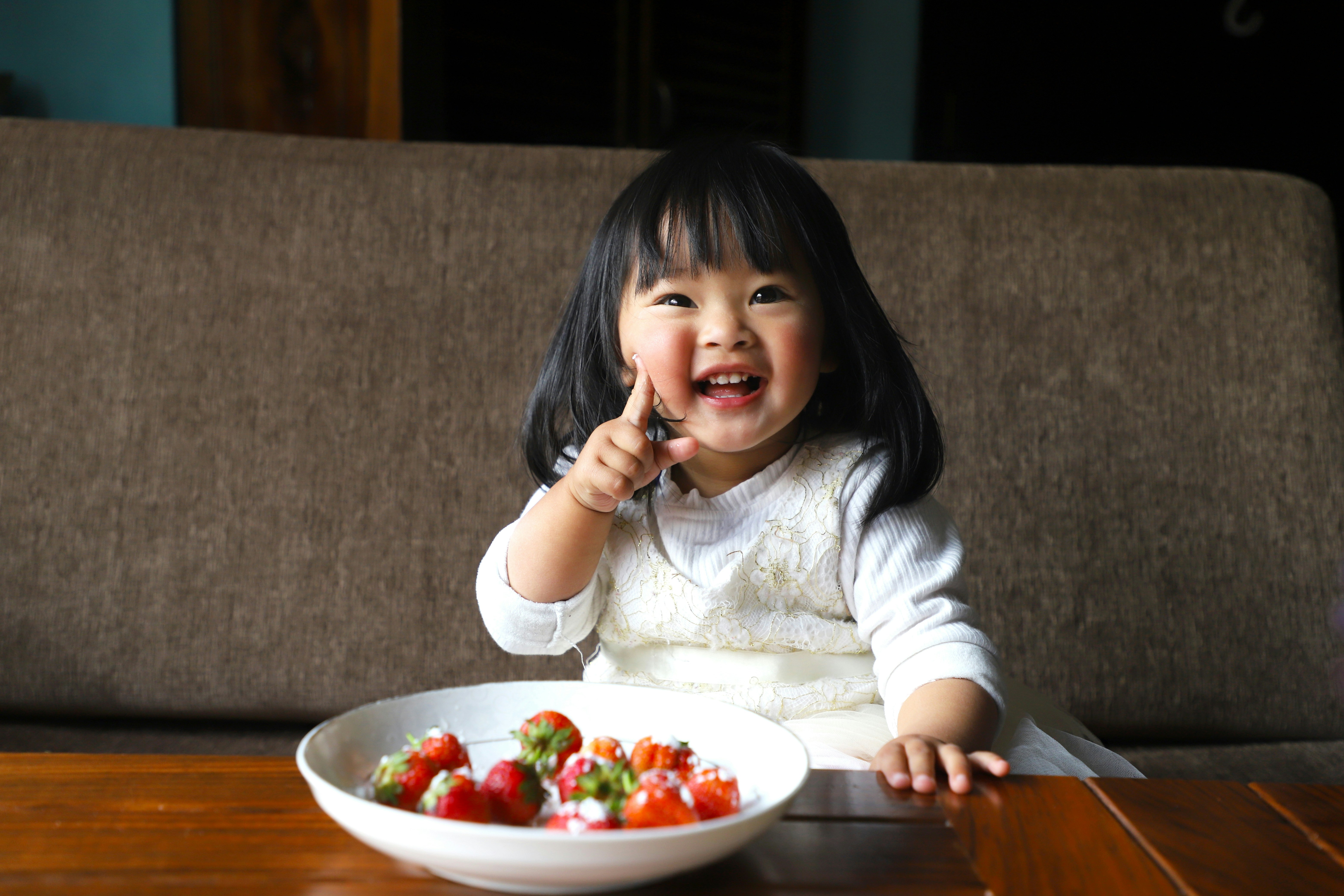 Child enjoying strawberries