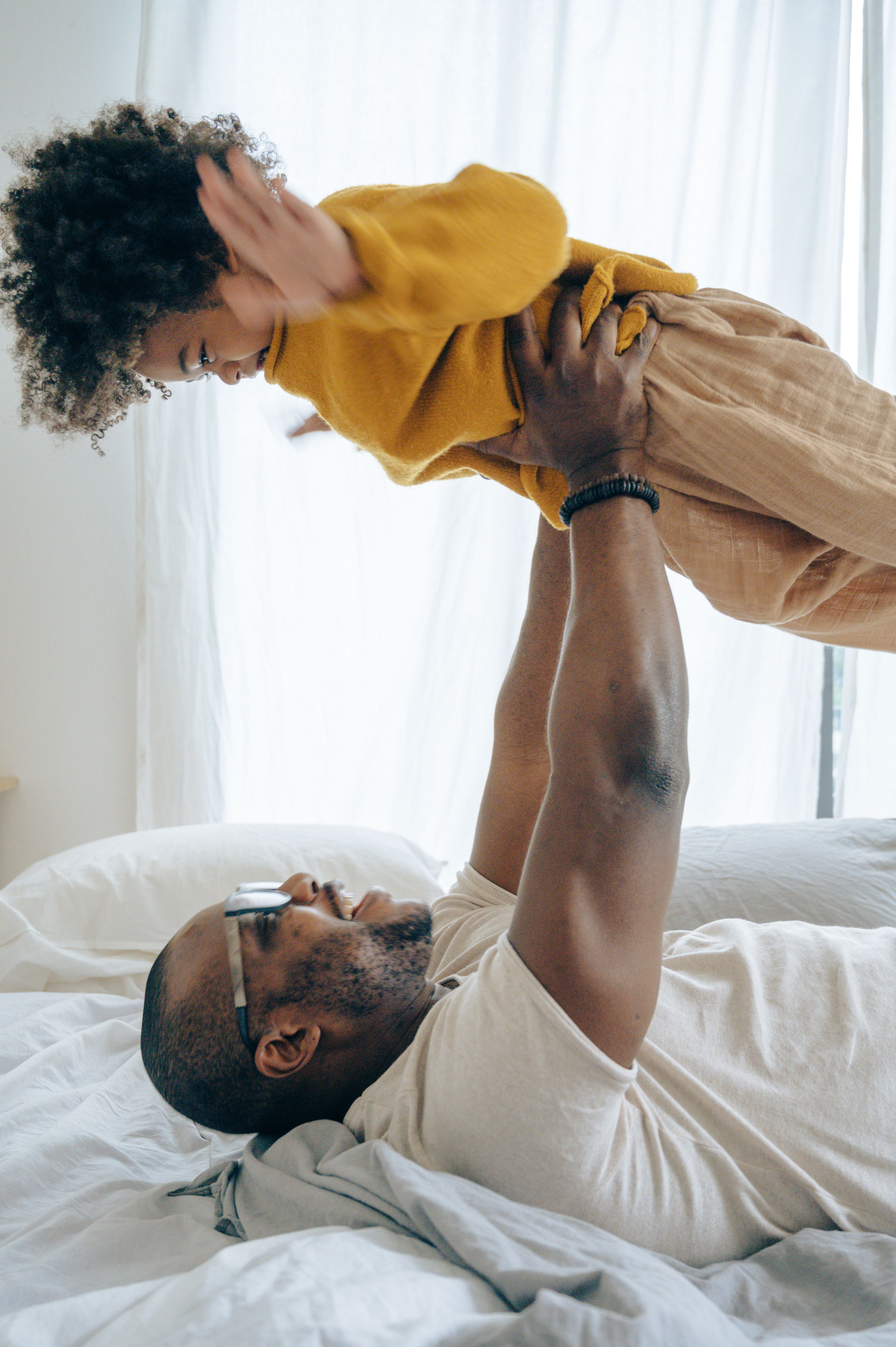 Parent leaning in close with their child