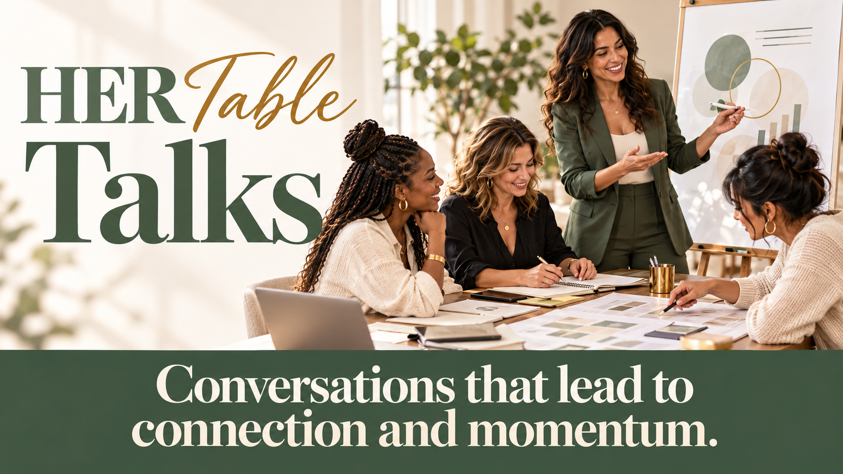 Four women around a table with journals and notes, one standing and smiling as she talks through a chart