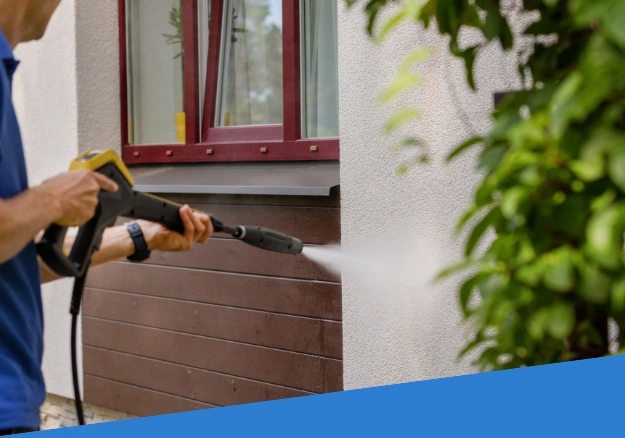 Soft washing side of house in Northland