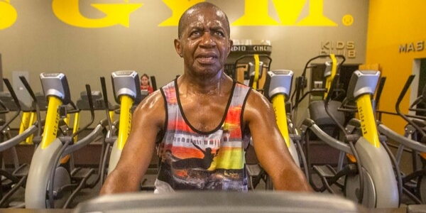 Lee Moultrie exercising at a gym as part of an active wellness routine.