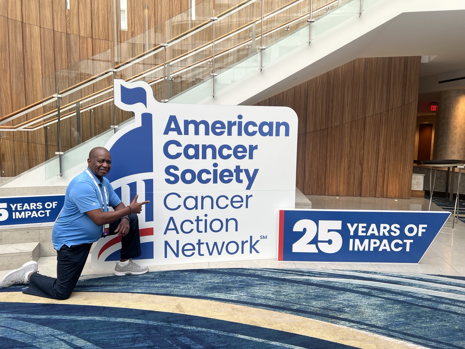 Lee Moultrie with American Cancer Society Cancer Action Network 25 Years of Impact display