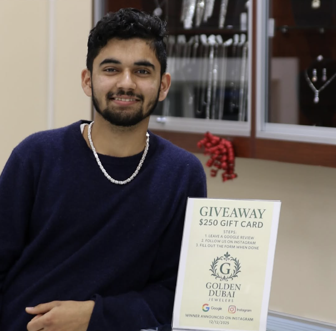 A member of the Golden Dubai Jewelers family inside the Middletown store