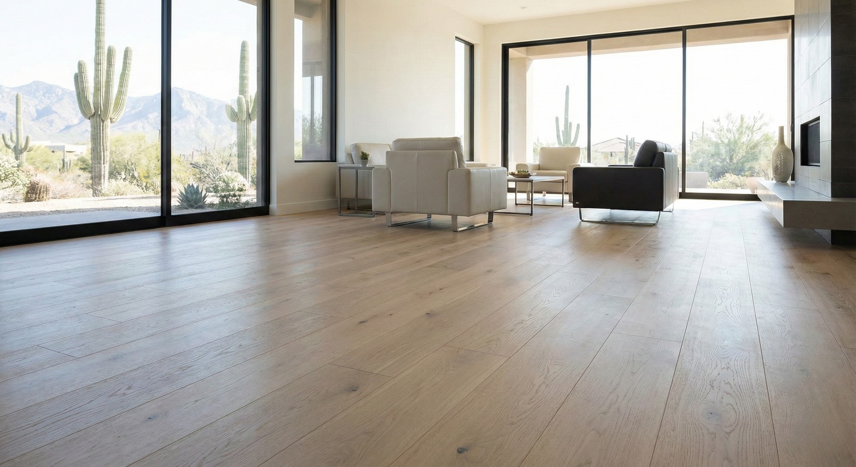 Modern flooring in a bright Tucson home featuring floor-to-ceiling windows with views of the Sonoran Desert