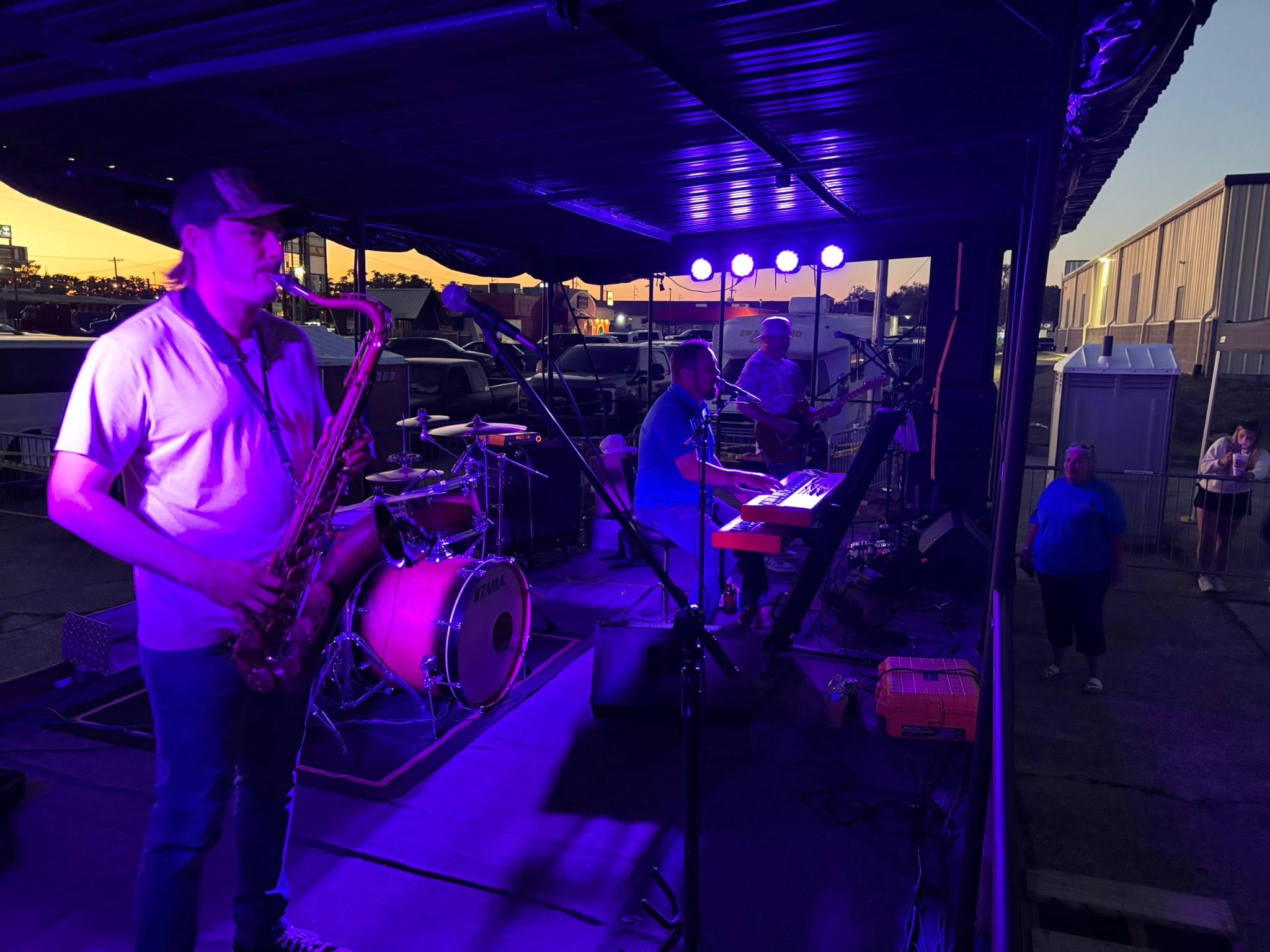 Saxophone player under the stage lights