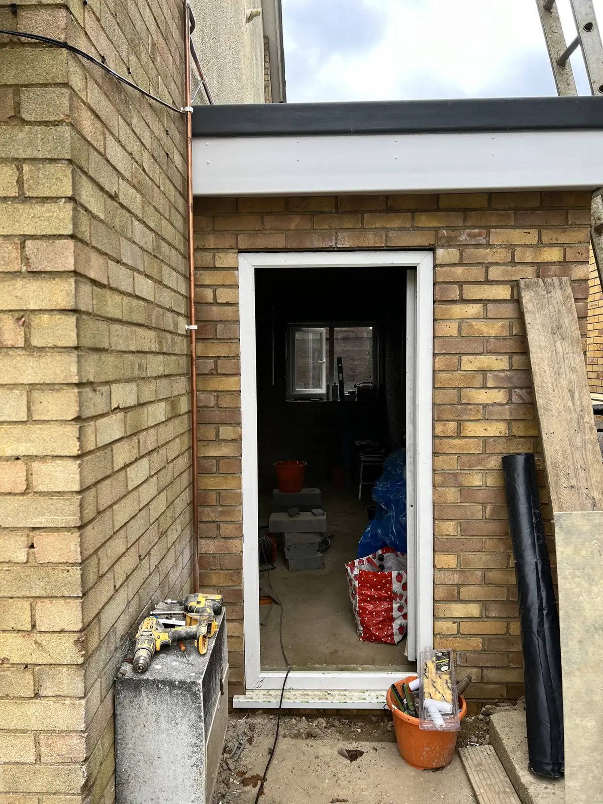 Finished brick side extension with a glazed door