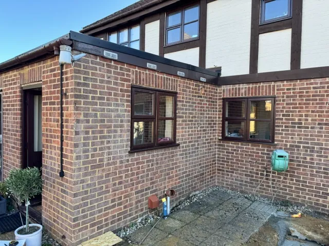 Finished single-storey brick extension at the back of a house