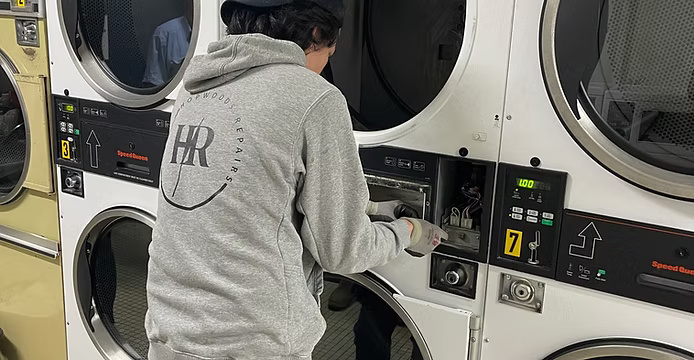 Technician working on appliance at the workshop