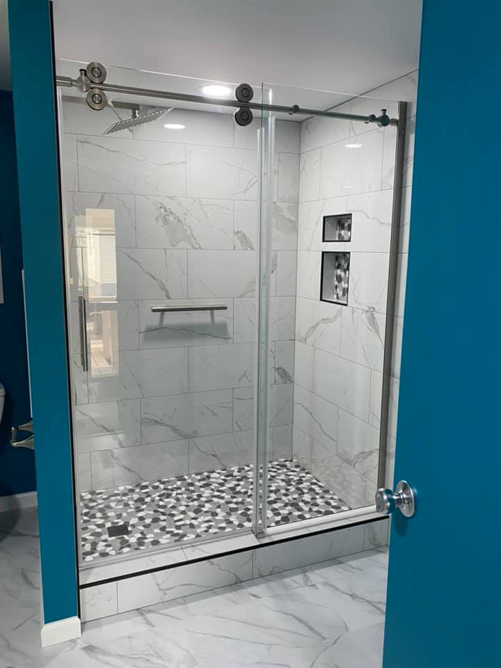 Bathroom Remodeling — Marble-look walk-in shower, glass barn door