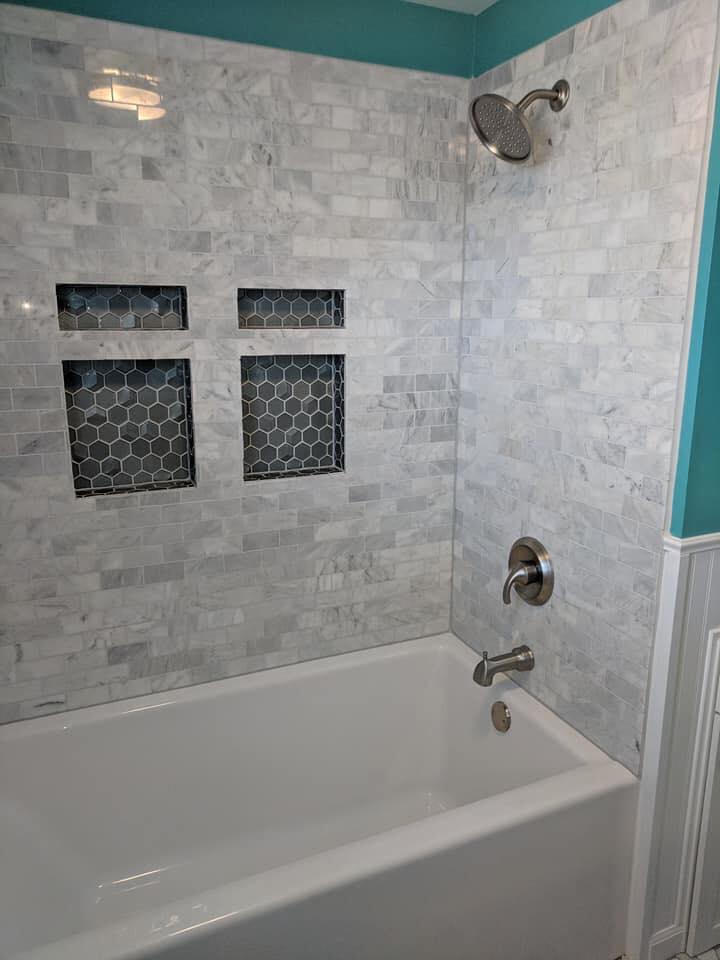 Tile Installation — Marble mosaic tub surround, hexagon niche accents