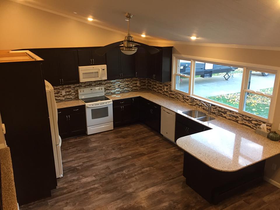 Kitchen Remodeling — Dark espresso cabinets, granite peninsula