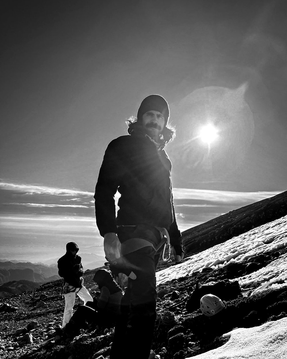 Ricardo Guaderrama on the snow of Pico de Orizaba, the sun behind him