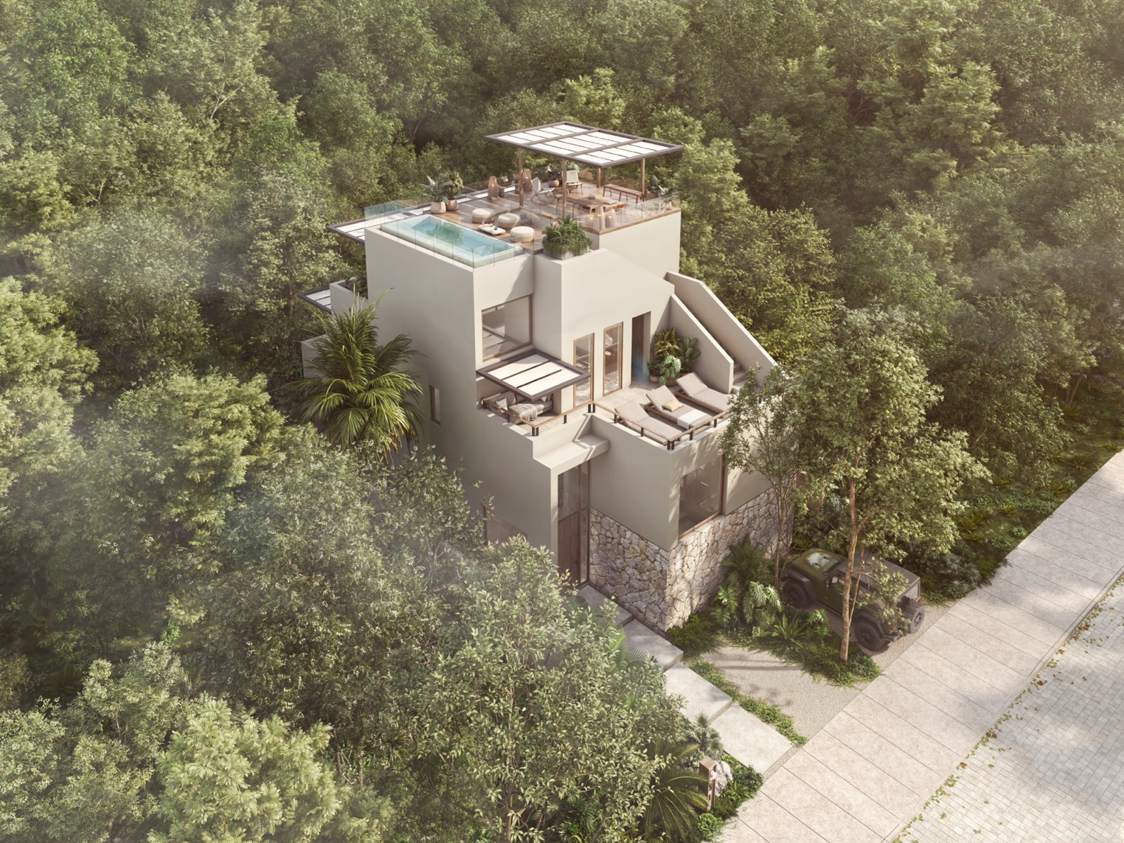 Vista aérea de Casa Romeo entre la selva con rooftop y alberca