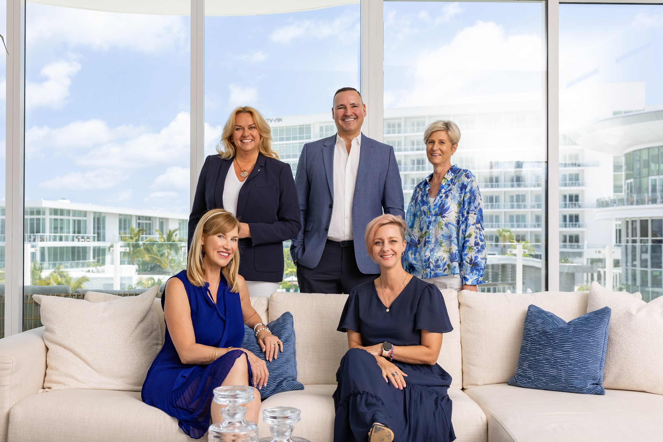 Professional realtor team portrait inside a bright luxury residence