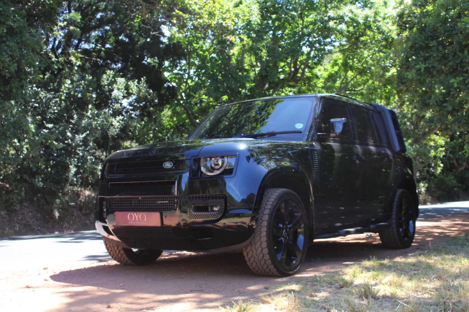 Black 2022 Land Rover Defender D300 parked outdoors.