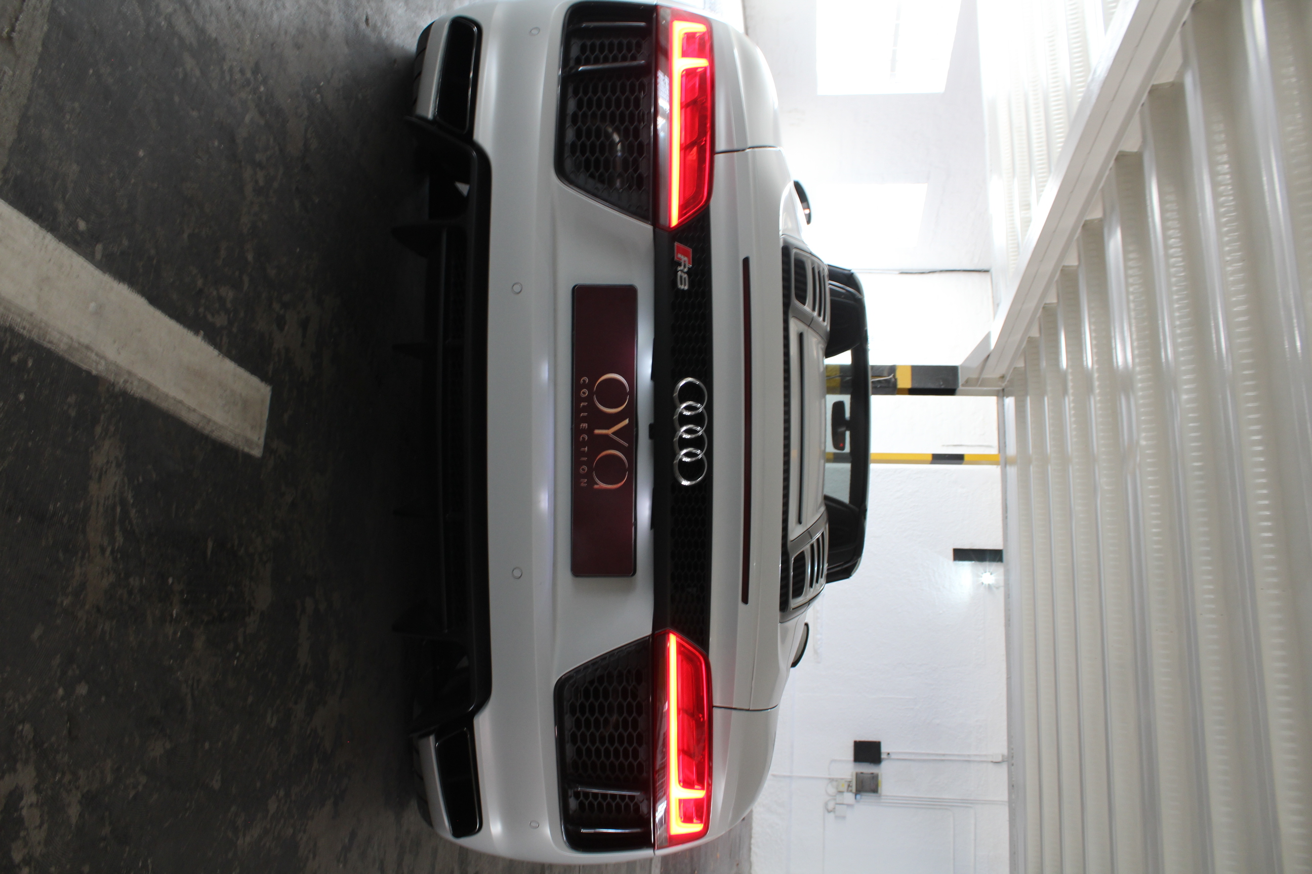 White 2019 Audi R8 Spyder V10 Convertible rear angle.